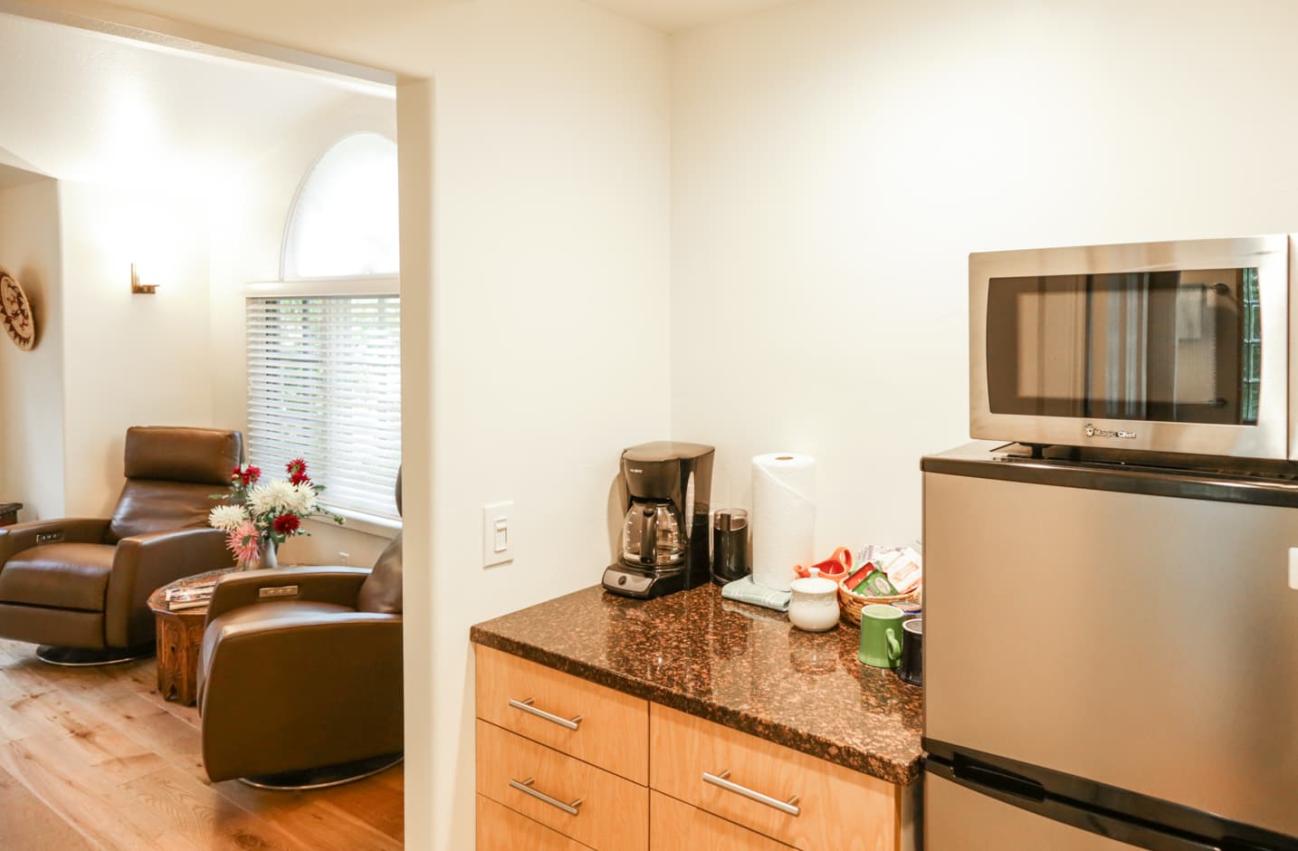 Kitchenette with coffee maker and fridge in the Garden Room