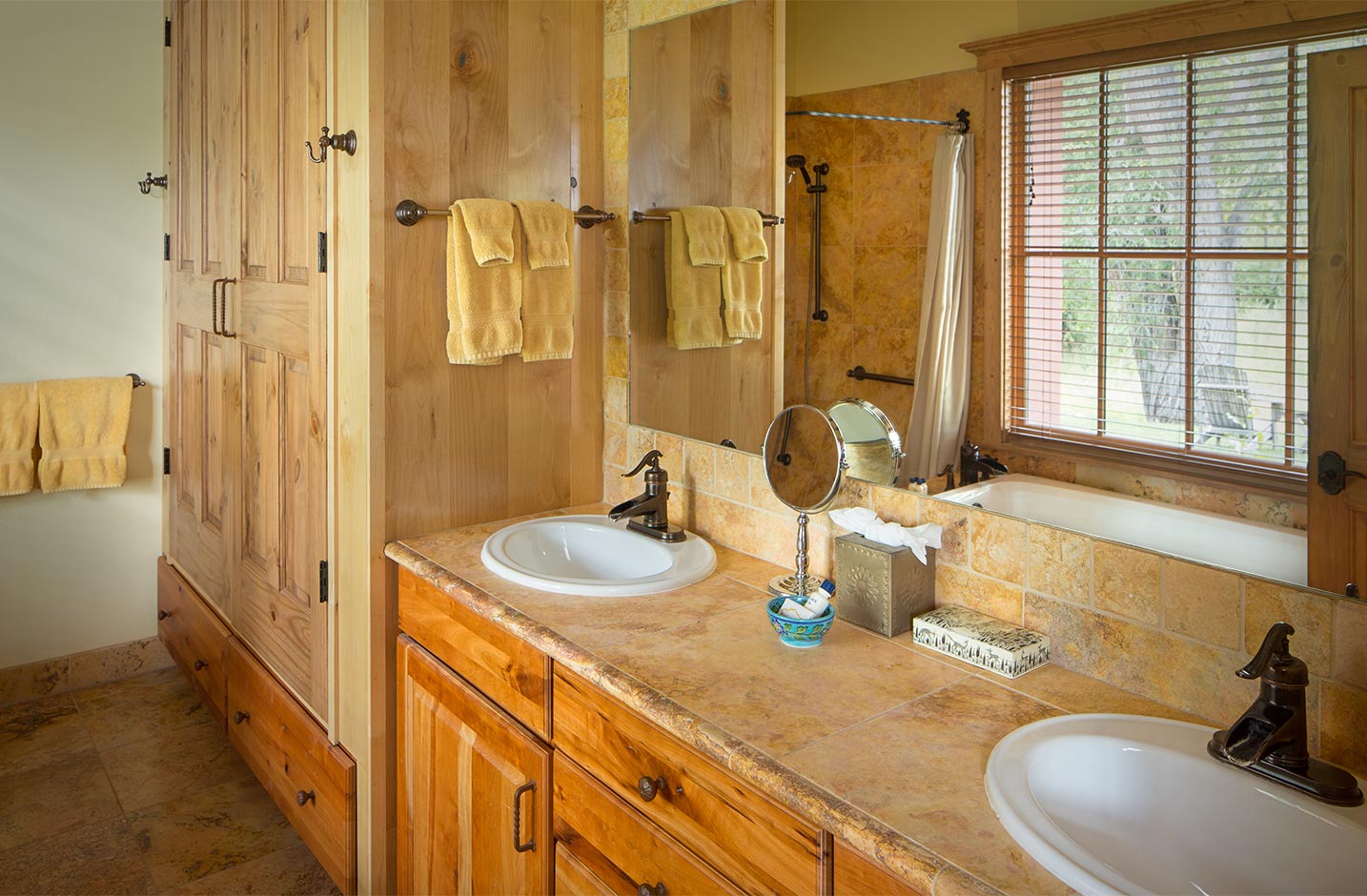 Bathroom with double vanity sinks and a walk-in shower