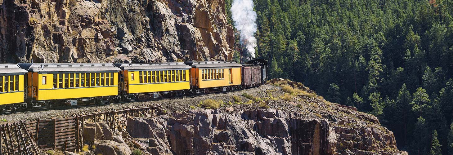 Historic steam train on a mountain pass