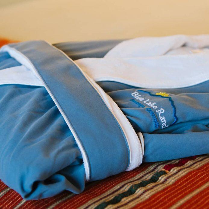 Blue and white robe with Blue Lake Ranch embroidered on the left side