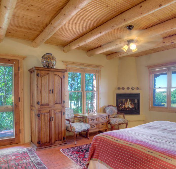 interior of a colorado lodging option with red bedspread