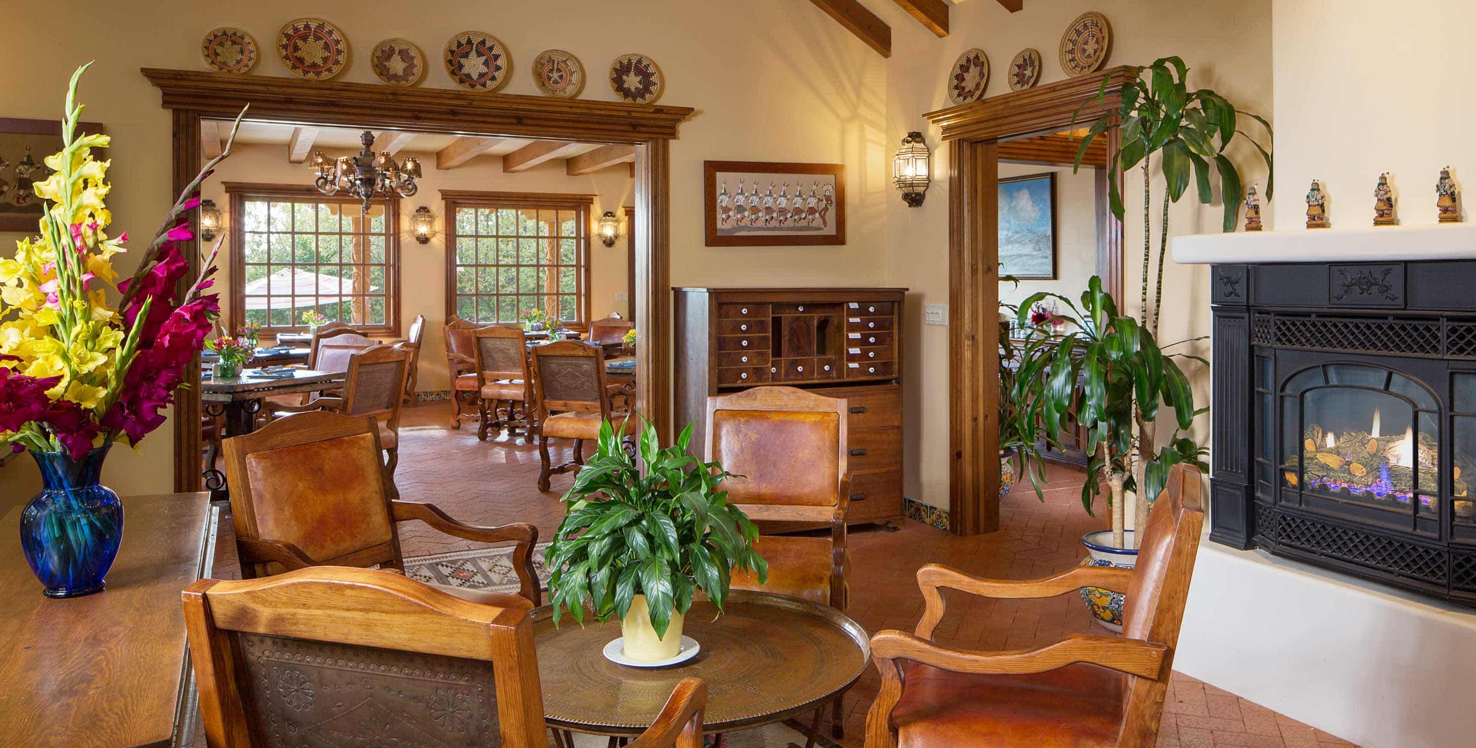 Large room with a gas fireplace and table with four chairs