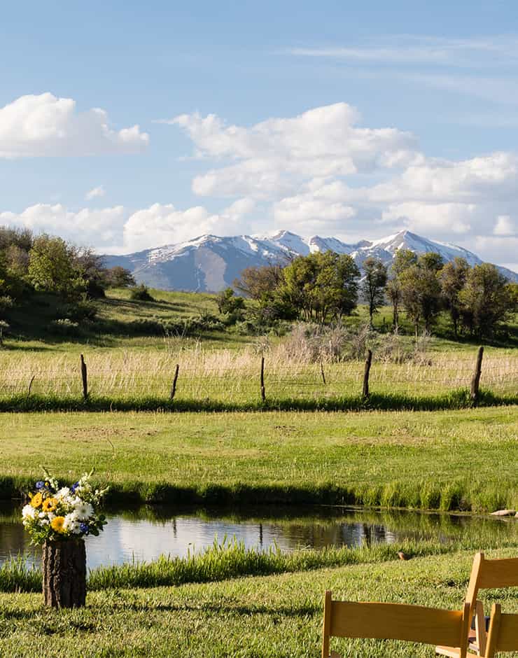 Blue Lake Ranch wedding event with snow capped mountains in the background